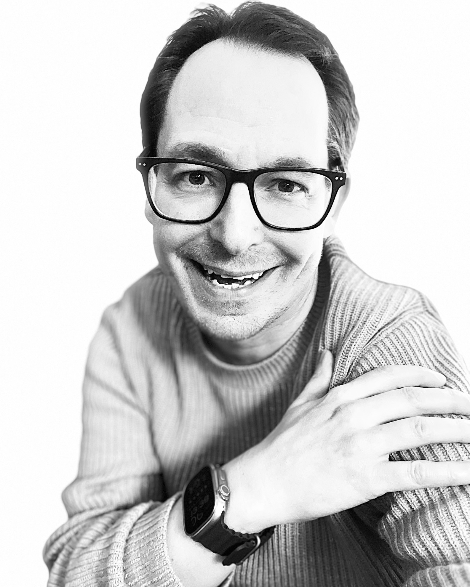 Kai Flockenhaus lächelt in die Kamera
